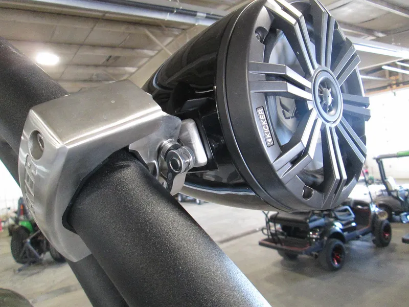 Slide: The Image of Close-up of a 2023 Tahoe 210 Si Limited boat speaker mounted on a metal bar. - 49