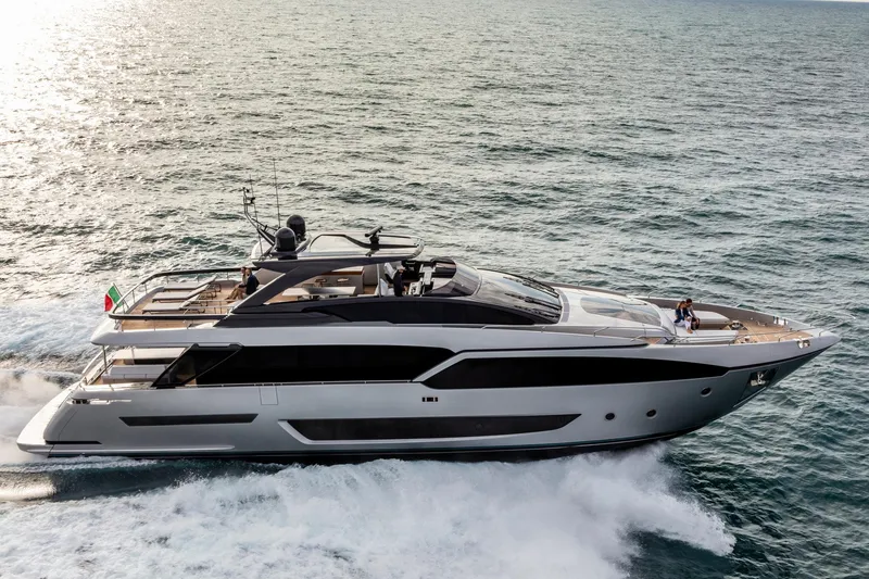 Slide: The Image of 2024 Riva 90' Argo luxury yacht cruising on the ocean. - 10