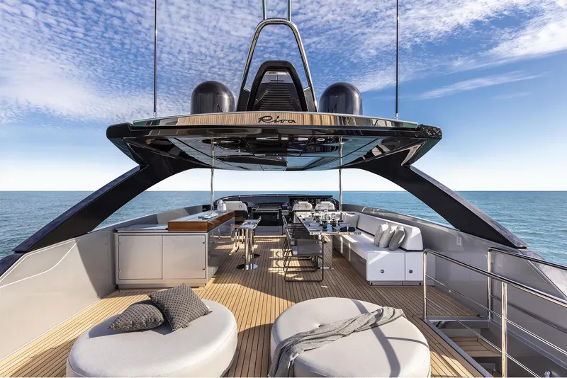 Slide: The Image of Luxurious deck of 2024 Riva 90' Argo yacht with modern seating and ocean view. - 11