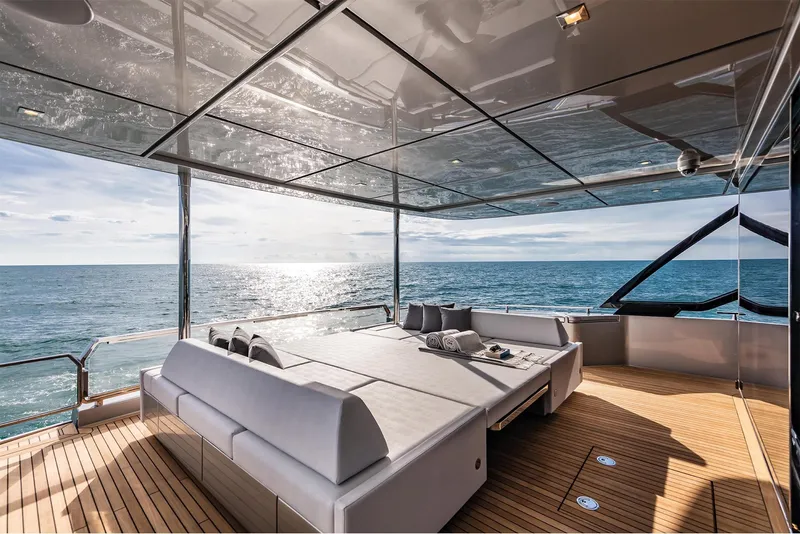 Slide: The Image of Luxury deck of 2024 Riva 90' Argo yacht with ocean view and modern seating. - 12
