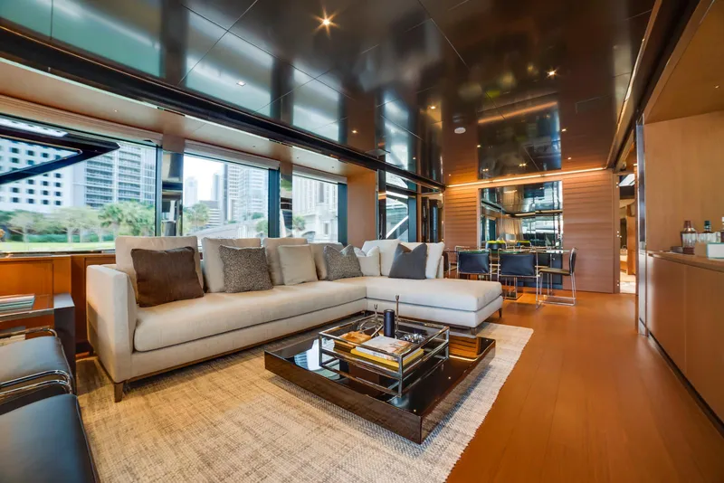 Slide: The Image of Luxurious interior of 2024 Riva 90' Argo yacht with modern furnishings and city view. - 15