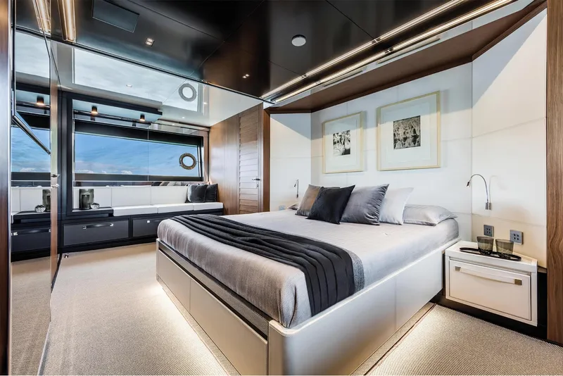 Slide: The Image of Luxurious bedroom interior of 2024 Riva 90' Argo yacht with modern design and large windows. - 19