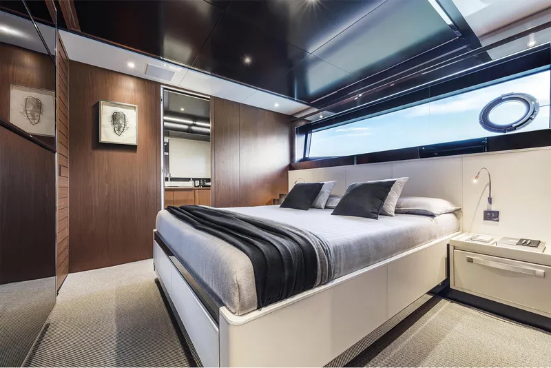 Slide: The Image of Luxurious bedroom interior of 2024 Riva 90' Argo yacht with modern design and large window. - 22