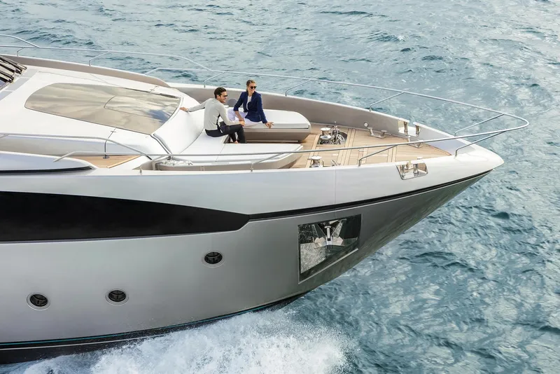 Slide: The Image of 2024 Riva 90' Argo luxury yacht cruising with passengers on deck. - 3