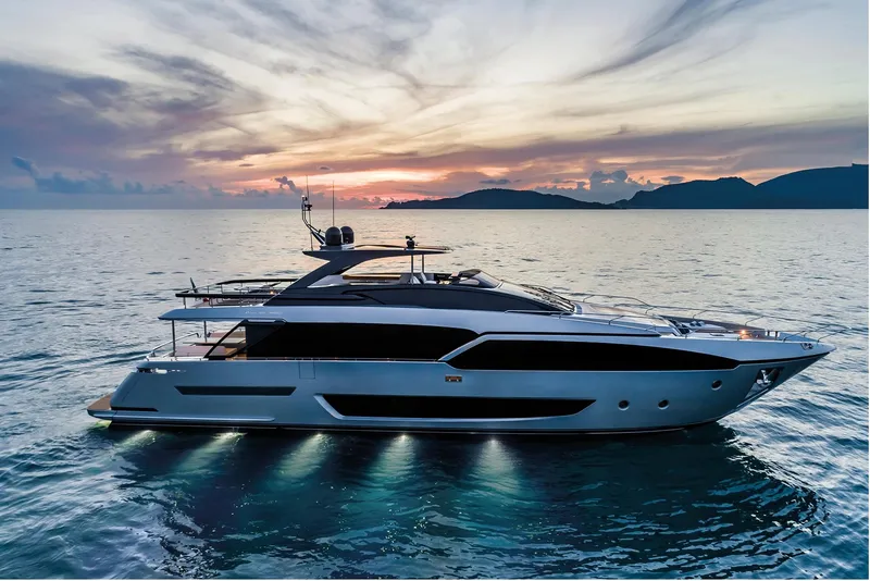Slide: The Image of 2024 Riva 90' Argo luxury yacht at sunset on the open sea. - 4