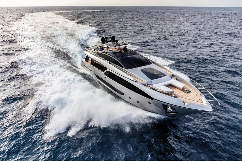 Slide: The Image of 2024 Riva 90' Argo luxury yacht cruising on open sea. - 5