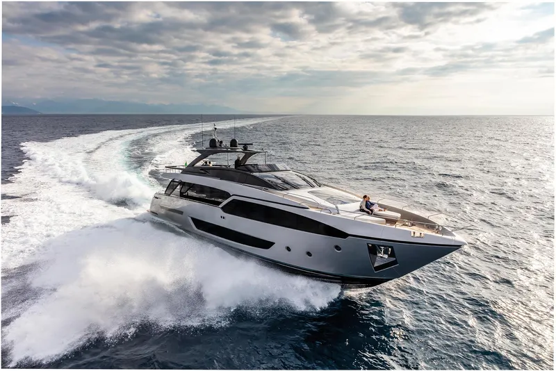 Slide: The Image of 2024 Riva 90' Argo luxury yacht cruising on open water. - 8