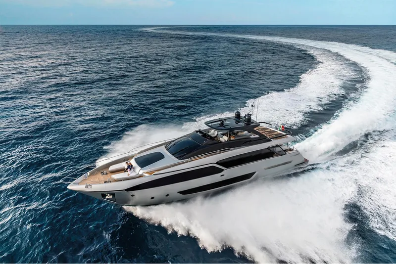 Slide: The Image of 2024 Riva 90' Argo luxury yacht cruising on open sea. - 9