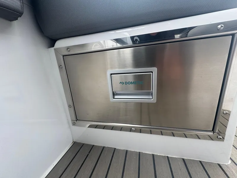 Slide: The Image of Stainless steel Dometic drawer on 2023 Iguana Sport boat interior. - 18