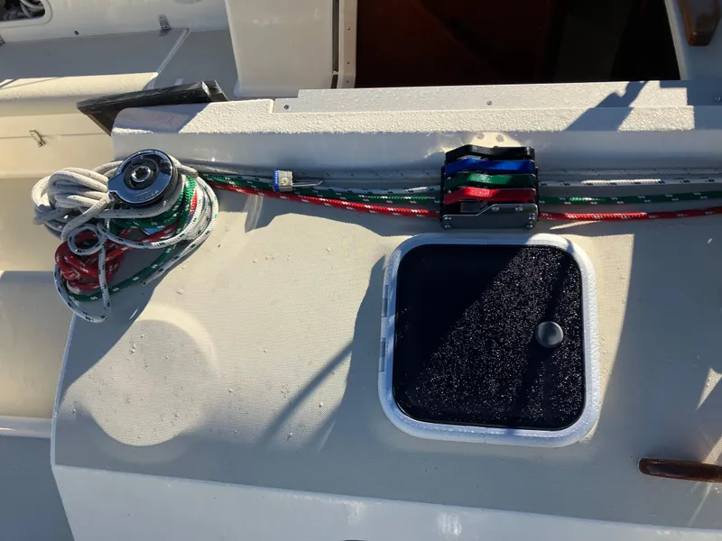 Slide: The Image of Sailboat deck with ropes and winch on a 1989 Pearson 39-2. - 12