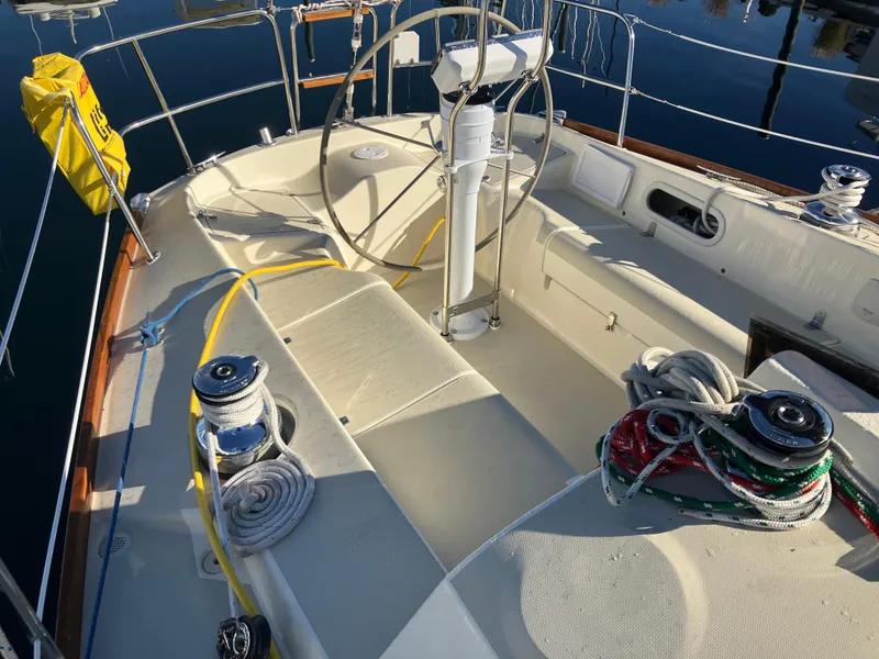 Slide: The Image of Cockpit of 1989 Pearson 39-2 sailboat with steering wheel and ropes. - 13