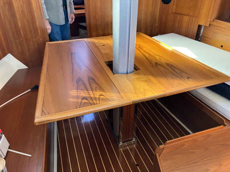 Slide: The Image of Interior of 1989 Pearson 39-2 sailboat with wooden table and flooring. - 17