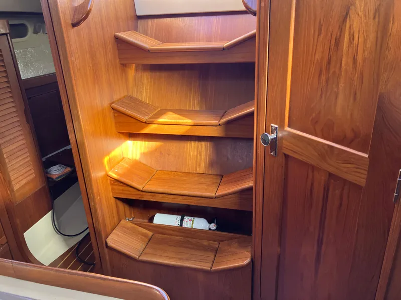 Slide: The Image of Wooden interior shelves on a 1989 Pearson 39-2 sailboat. - 19