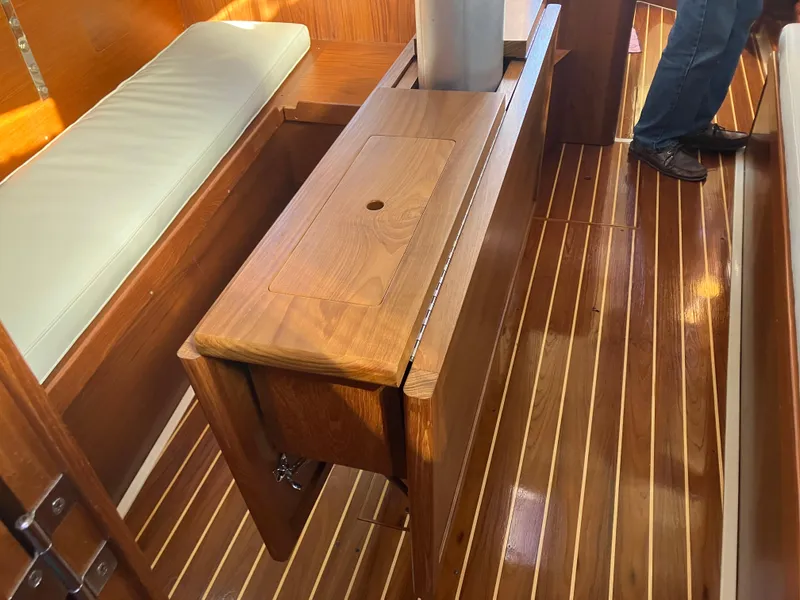 Slide: The Image of Interior of 1989 Pearson 39-2 sailboat with polished wood flooring and seating. - 23