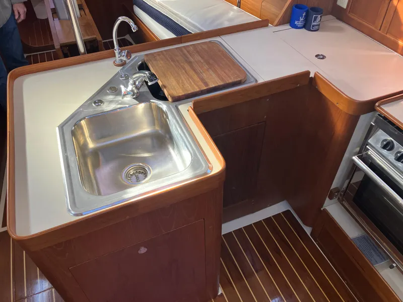 Slide: The Image of 1989 Pearson 39-2 yacht kitchen with sink, faucet, and wooden countertop. - 27