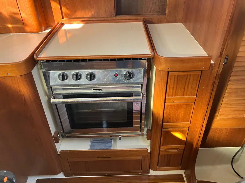 Slide: The Image of Wooden yacht kitchen with a built-in stove, Pearson 39-2, 1989 model. - 28
