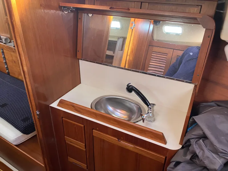 Slide: The Image of Wooden boat interior with sink and mirror, Pearson 39-2, 1989 model. - 31