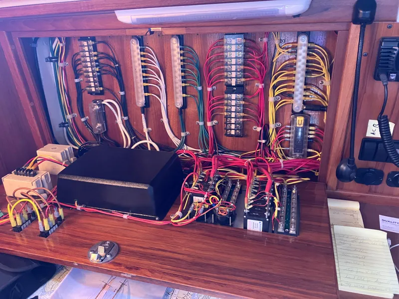 Slide: The Image of Electrical panel of a 1989 Pearson 39-2 sailboat with organized wiring and components. - 37