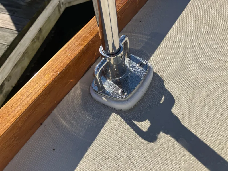Slide: The Image of Chrome fitting on Pearson 39-2 sailboat deck, 1989 model, with wood trim and textured surface. - 7