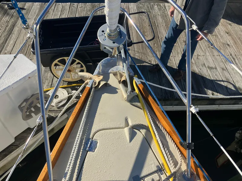 Slide: The Image of Bow of 1989 Pearson 39-2 sailboat with anchor and dock view. - 8
