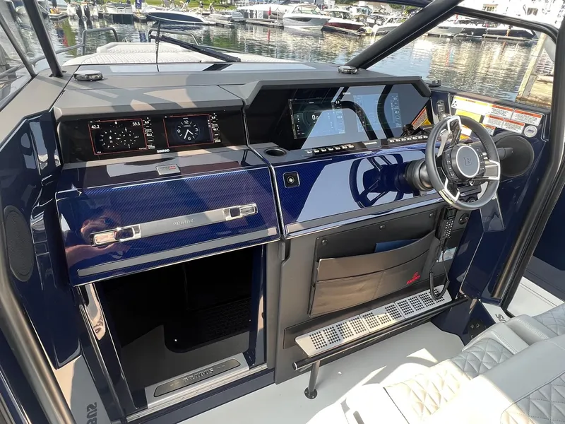 Slide: The Image of BRABUS Shadow 900 Deep Blue 2023 boat cockpit with modern dashboard and steering wheel. - 10