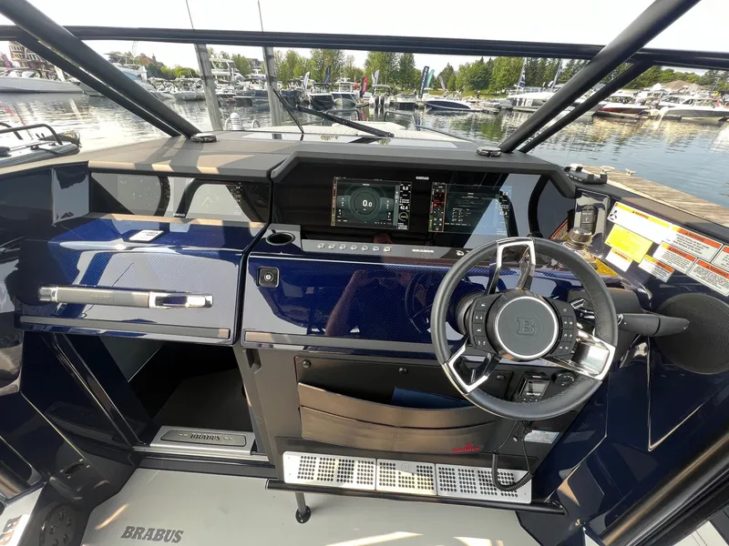 Slide: The Image of Cockpit of 2023 BRABUS Shadow 900 Deep Blue luxury boat with advanced navigation system. - 11