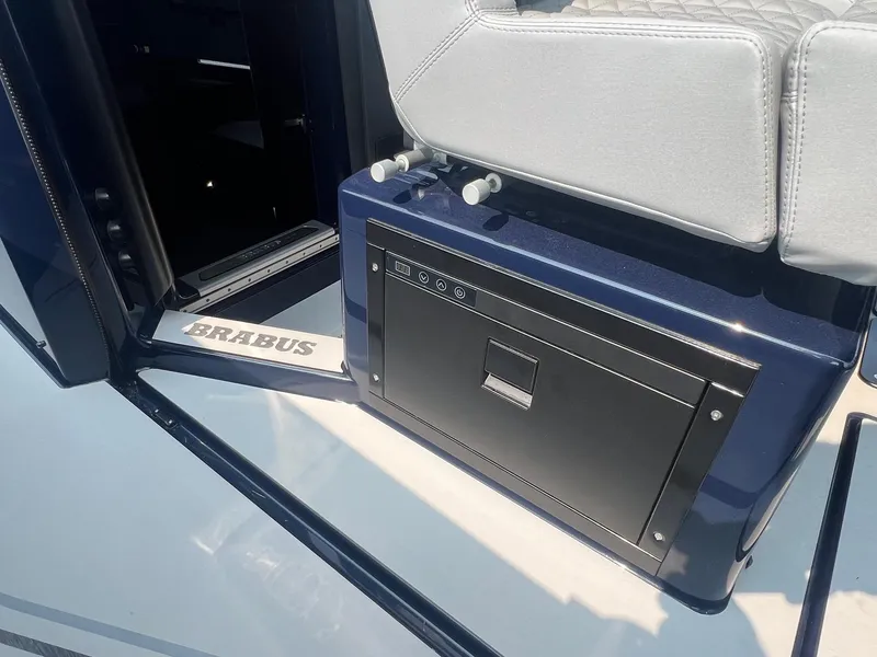 Slide: The Image of 2023 BRABUS Shadow 900 Deep Blue interior detail with seating and storage. - 17