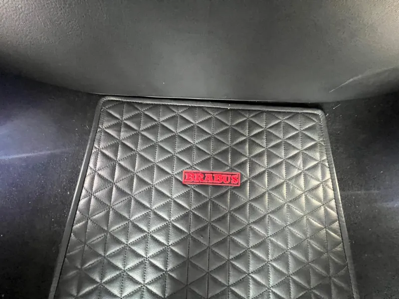 Slide: The Image of 2023 BRABUS Shadow 900 Deep Blue quilted floor mat with red BRABUS logo. - 20