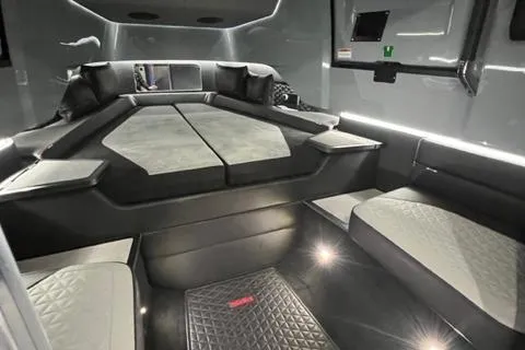 Slide: The Image of Interior of 2023 BRABUS Shadow 900 Deep Blue luxury boat cabin with modern seating and lighting. - 21