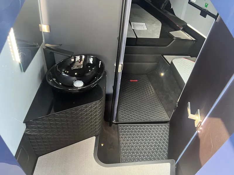 Slide: The Image of 2023 BRABUS Shadow 900 Deep Blue interior with modern bathroom and sleeping area. - 22