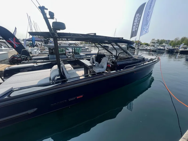 Slide: The Image of 2023 BRABUS Shadow 900 Deep Blue luxury boat docked at marina. - 3