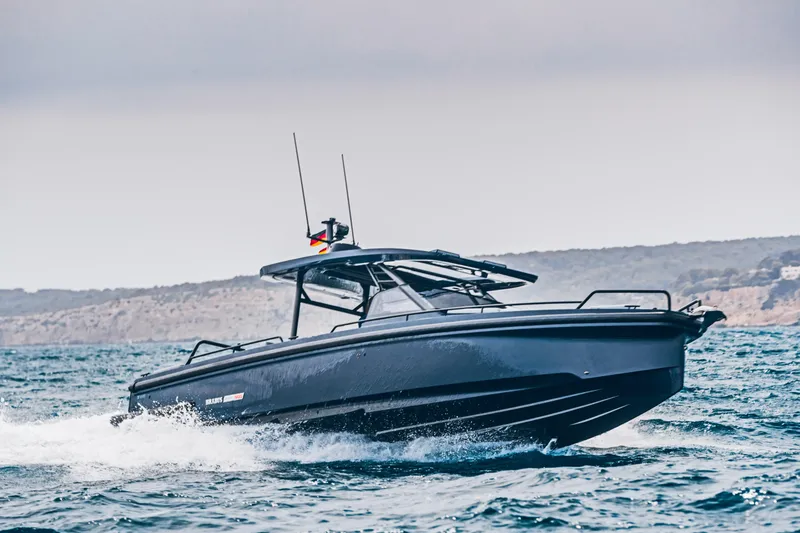 Slide: The Image of 2023 BRABUS Shadow 900 Deep Blue boat cruising on the ocean. - 31