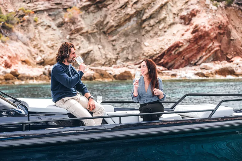 Slide: The Image of Couple enjoying drinks on a 2023 BRABUS Shadow 900 Deep Blue boat. - 35