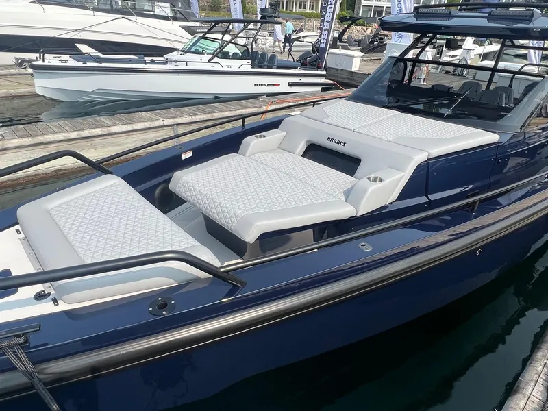 Slide: The Image of 2023 BRABUS Shadow 900 Deep Blue luxury boat docked at marina. - 4