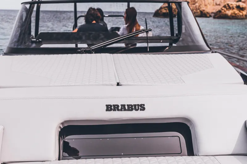 Slide: The Image of 2023 BRABUS Shadow 900 Deep Blue luxury boat on the water with passengers. - 41