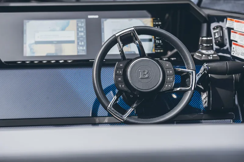 Slide: The Image of 2023 BRABUS Shadow 900 Deep Blue steering wheel and dashboard. - 45