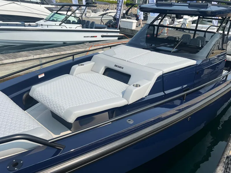 Slide: The Image of 2023 BRABUS Shadow 900 Deep Blue luxury boat docked at marina. - 5