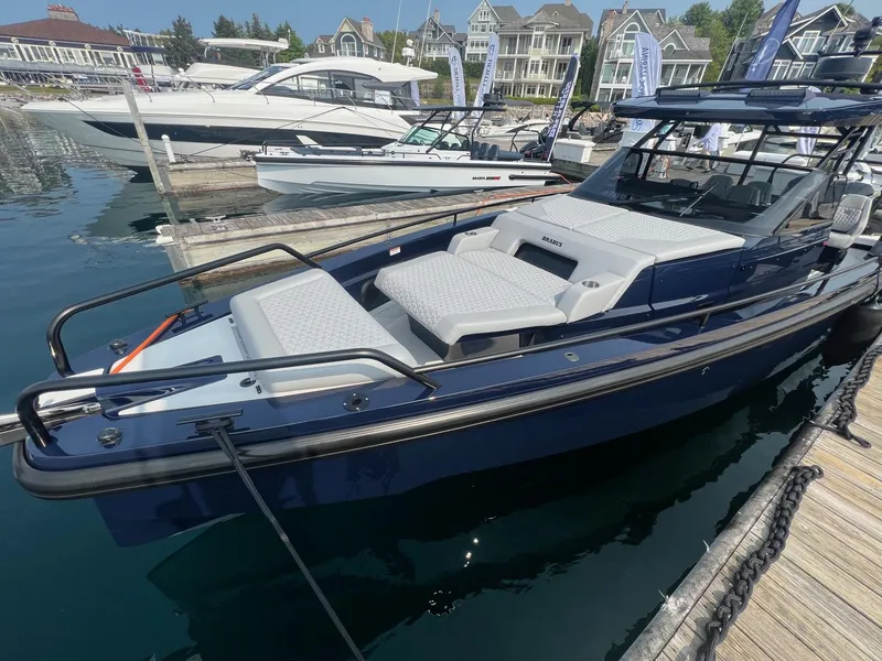 Slide: The Image of 2023 BRABUS Shadow 900 Deep Blue luxury boat docked at marina. - 6