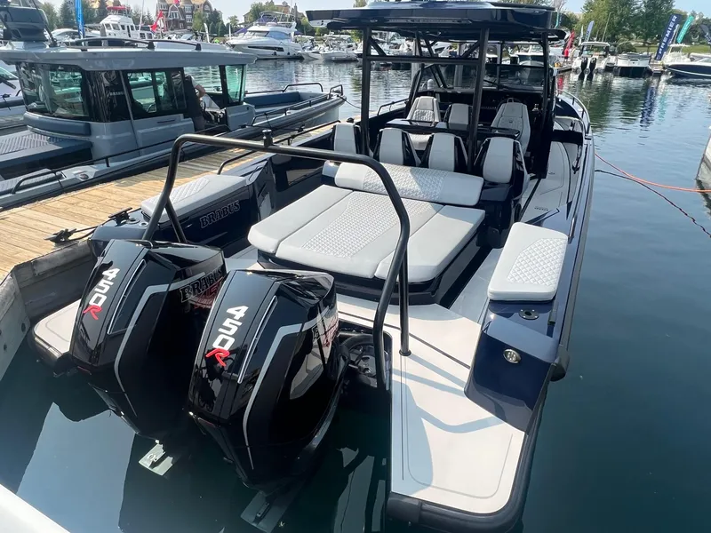 Slide: The Image of 2023 BRABUS Shadow 900 Deep Blue luxury boat with twin engines docked at marina. - 7