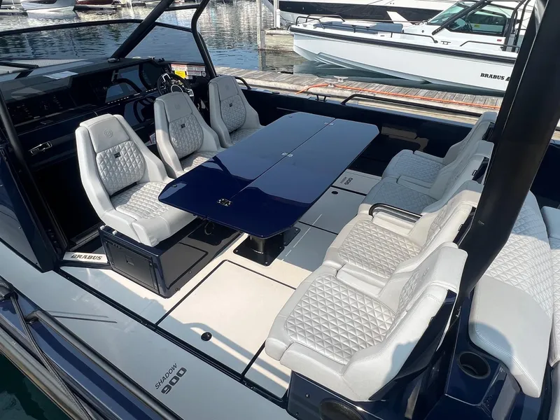 Slide: The Image of 2023 BRABUS Shadow 900 Deep Blue luxury boat interior with plush seating and sleek design. - 8