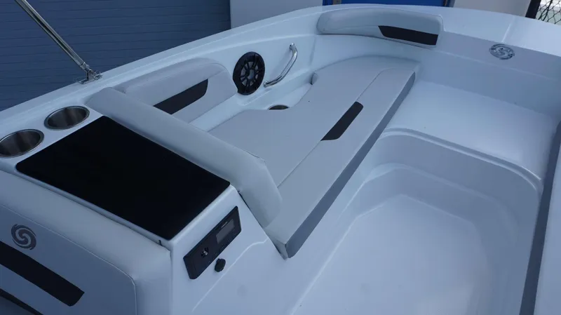 Slide: The Image of Interior of 2023 Hurricane 185 SS boat with seating, cup holders, and audio system. - 10
