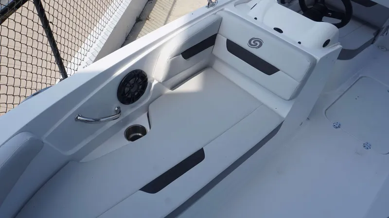 Slide: The Image of 2023 Hurricane 185 SS boat interior with seating, speaker, and cup holder. - 12