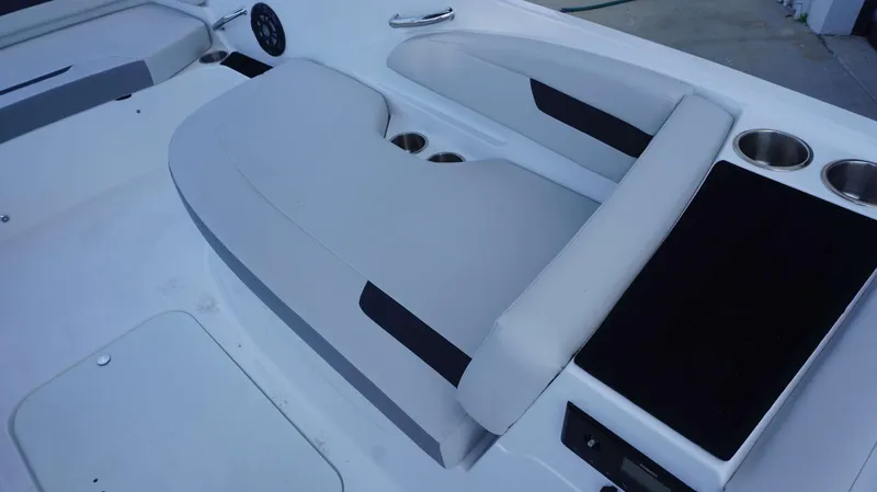 Slide: The Image of 2023 Hurricane 185 SS boat interior with cushioned seating and cup holders. - 14