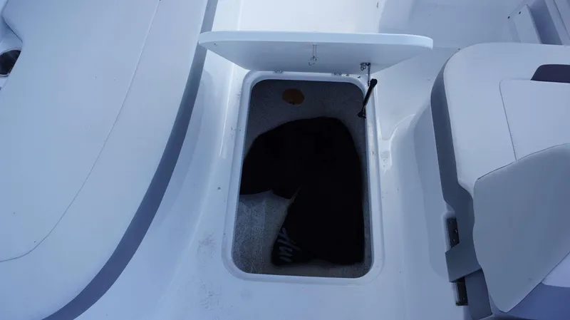 Slide: The Image of Open storage compartment on a 2023 Hurricane 185 SS boat. - 7