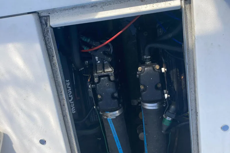 Slide: The Image of Engine compartment of a 1992 Sea Ray 300 Weekender boat, featuring MerCruiser components. - 16