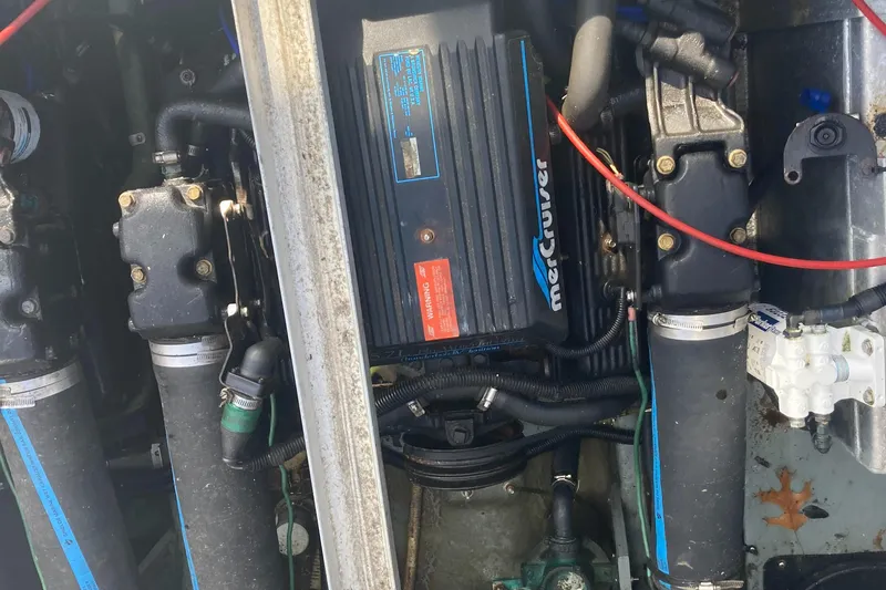 Slide: The Image of Engine compartment of a 1992 Sea Ray 300 Weekender boat, featuring a MerCruiser engine. - 19