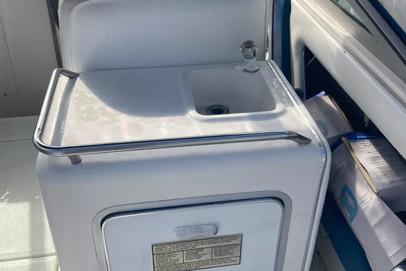 Slide: The Image of 1992 Sea Ray 300 Weekender boat sink and storage area. - 5