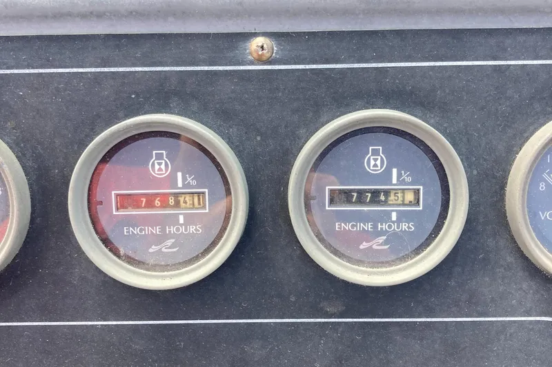 Slide: The Image of Engine hour meters on a 1992 Sea Ray 300 Weekender boat dashboard. - 6