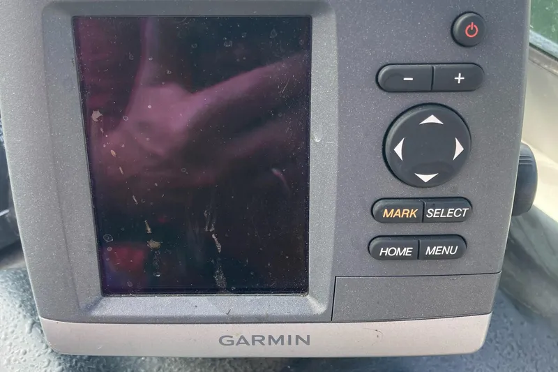 Slide: The Image of Garmin navigation device on 1992 Sea Ray 300 Weekender boat dashboard. - 8