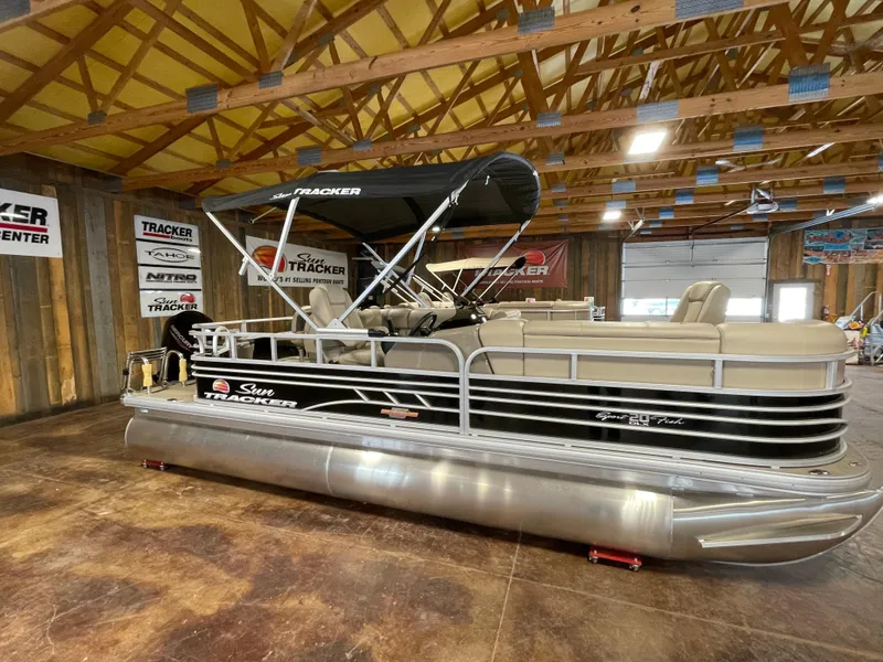 The Image of 2023 Sun Tracker SportFish 20 DLX pontoon boat in showroom. - 0